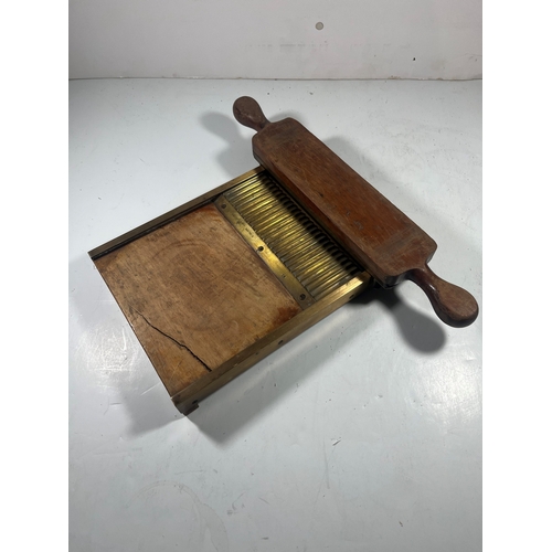 140 - A 19TH CENTURY PILL MACHINE
of typical form, brass mounted, with roller -- 16½in. (42cm.) widetwo cr... 