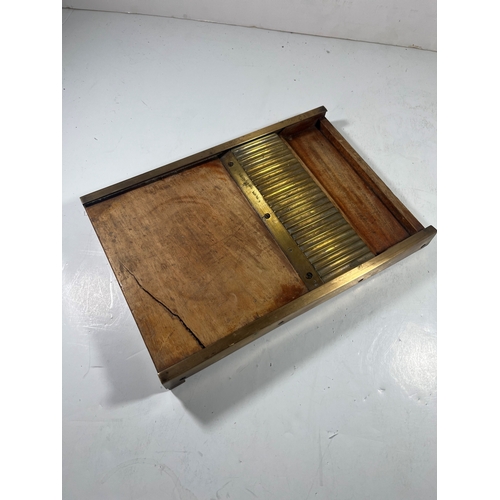 140 - A 19TH CENTURY PILL MACHINE
of typical form, brass mounted, with roller -- 16½in. (42cm.) widetwo cr... 