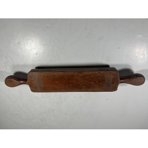 140 - A 19TH CENTURY PILL MACHINE
of typical form, brass mounted, with roller -- 16½in. (42cm.) widetwo cr... 
