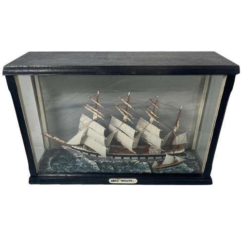 150 - A WATERLINE MODEL OF THE FOUR MASTED BARQUE GRACE DARLING (1864)
with 9½in. carved hull, painted tin... 