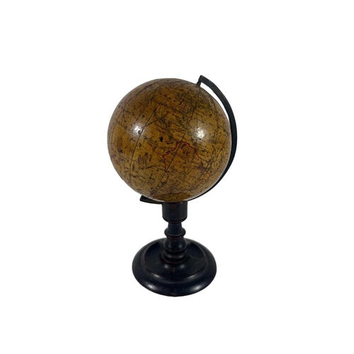 153 - A 4IN. TERRESTRIAL DESK GLOBE BY SMITH & SON, LONDON, 1867
12 printede gores with hand outlined red ... 