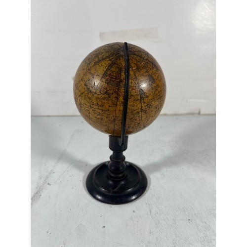 153 - A 4IN. TERRESTRIAL DESK GLOBE BY SMITH & SON, LONDON, 1867
12 printede gores with hand outlined red ... 