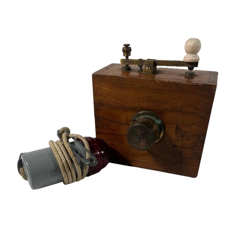 160 - A WOODEN BRASS MORSE LAMP FOR A YACHT, CIRCA 1920
with small bullseye lens, lacquered brass relay ar... 