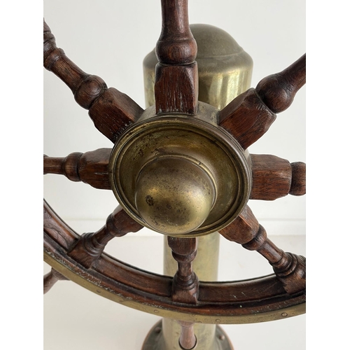 41 - AN EIGHT-SPOKE SHIP'S HELM, 20TH CENTURY
a brass-bound ship's helm mounted on tapered brass pillar s... 