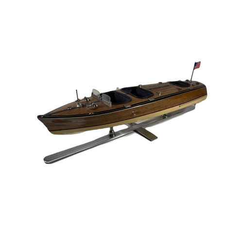 48 - MODERN STATIC DISPLAY MODEL OF A RIVA MOTOR LAUNCH
wooden hull with metal fittings, mounted on a chr... 