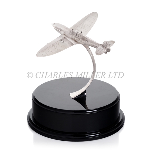 311 - A MODERN SILVER MODEL OF A SPITFIRE IN FLIGHT, LONDON, 2009
the Spitfire banking on a curved silver ... 