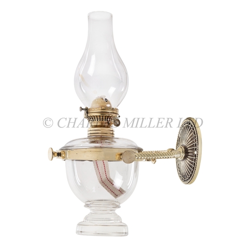 63 - A LARGE BRASS AND GLASS BULKHEAD OIL LAMP, CIRCA 1900
with clear glass vase, 1in. wick assembly and ... 