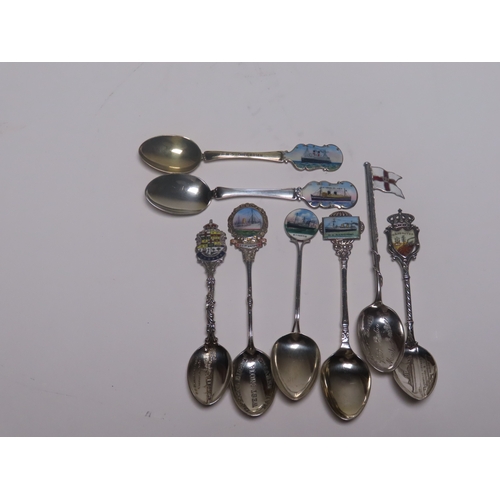 154 - A COLLECTION OF OCEAN LINER SILVER, ENAMEL AND SILVER-PLATED SHIPS' SOUVENIR SPOONS
comprising Imper... 