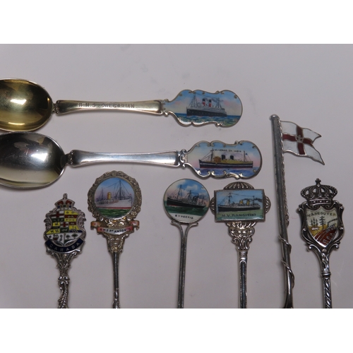 154 - A COLLECTION OF OCEAN LINER SILVER, ENAMEL AND SILVER-PLATED SHIPS' SOUVENIR SPOONS
comprising Imper... 