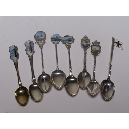 154 - A COLLECTION OF OCEAN LINER SILVER, ENAMEL AND SILVER-PLATED SHIPS' SOUVENIR SPOONS
comprising Imper... 