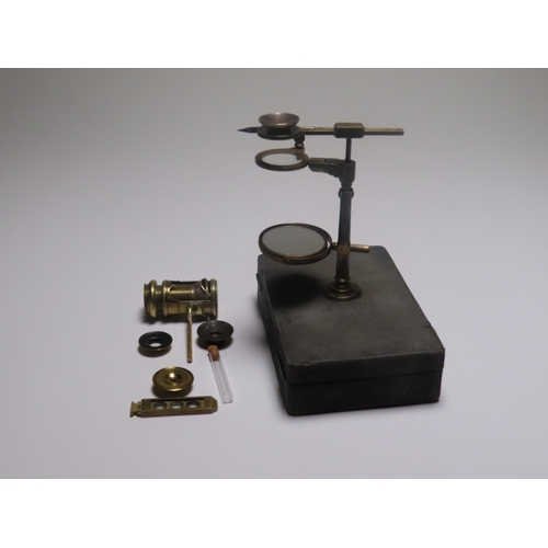 360 - A POCKET MICROSCOPE COMPENDIUM BY DOLLOND, CIRCA 1760
with screw barrel and aquatic attachments, con... 