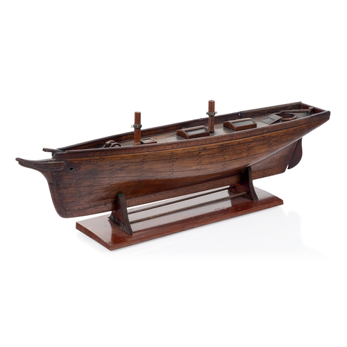 16 - A 19TH CENTURY CARPENTER'S MODEL FOR A TWO-MASTED YACHT
with planked and pinned 19in. hull and decks... 