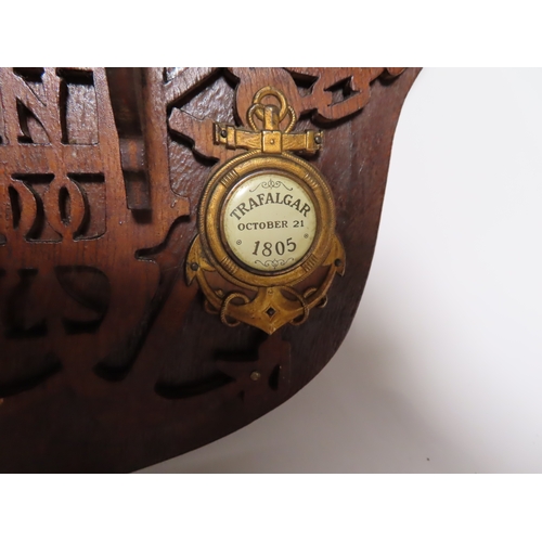 27 - A TRAFALGAR CENTENARY FRETWORK PLAQUE, 1905
with foliate border, depicting H.M.S. Victory to top wit... 