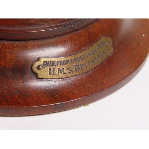 29 - AN INKWELL MADE FROM H.M.S. BRITANNIA TREEN
modelled as a capstan, with ceramic liner and brass prov... 