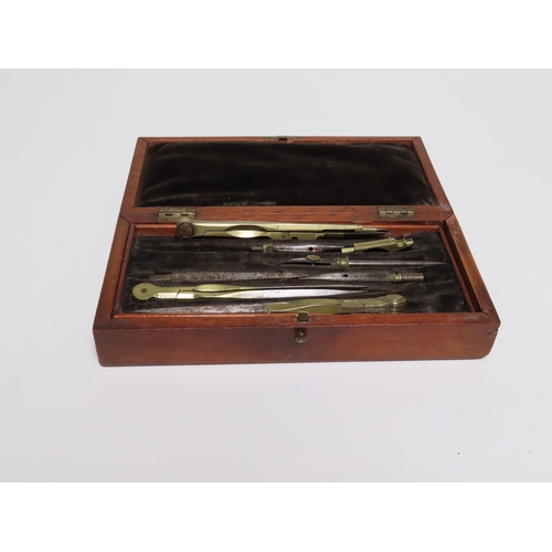 38 - AN EARLY 20TH CENTURY DRAWING SET
unsigned, a partially complete drawing set contained within black ... 