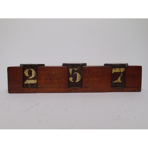 47 - A COURSE INDICATOR BOX, CIRCA 1920
with 3 hexagonal blocks numbered 0-9, hand painted, contained wit... 