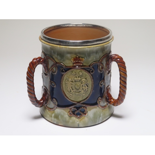 64 - A SILVER MOUNTED LAMBETH WARE TRAFALGAR CENTENARY TYG BY ROYAL DOULTON, CIRCA 1905
with three panels... 