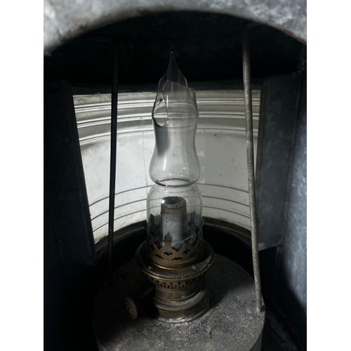 91 - A MASTHEAD LAMP, 20TH CENTURY
galvanised tin with Fresnel-type lens, complete with burner -- 19in. (... 