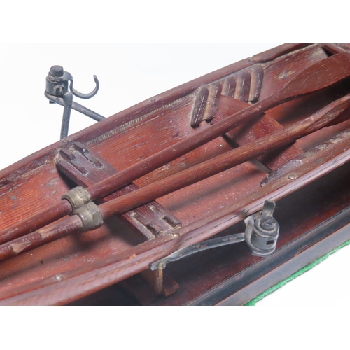 15 - A 19TH CENTURY MODEL FOR A SINGLE PERSON THAMES ROWING SKIFF
the 18in. hull carved from the solid, p... 