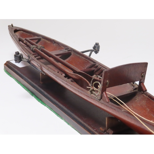 15 - A 19TH CENTURY MODEL FOR A SINGLE PERSON THAMES ROWING SKIFF
the 18in. hull carved from the solid, p... 