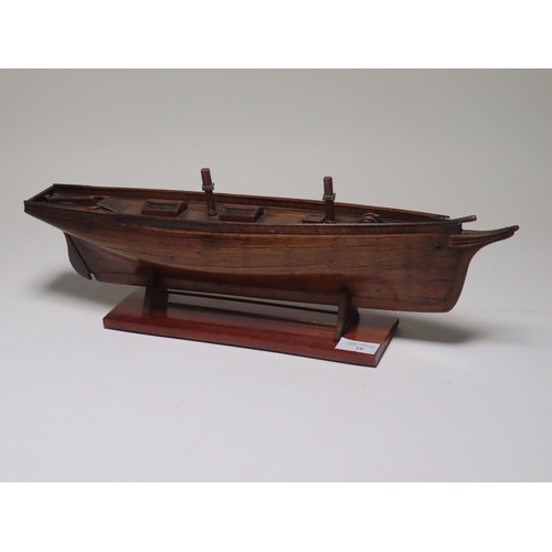 16 - A 19TH CENTURY CARPENTER'S MODEL FOR A TWO-MASTED YACHT
with planked and pinned 19in. hull and decks... 