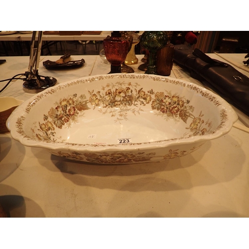 223 - Large ceramic oval bowl decorated with flowers, marked Pauldon place, England, reg no 135305