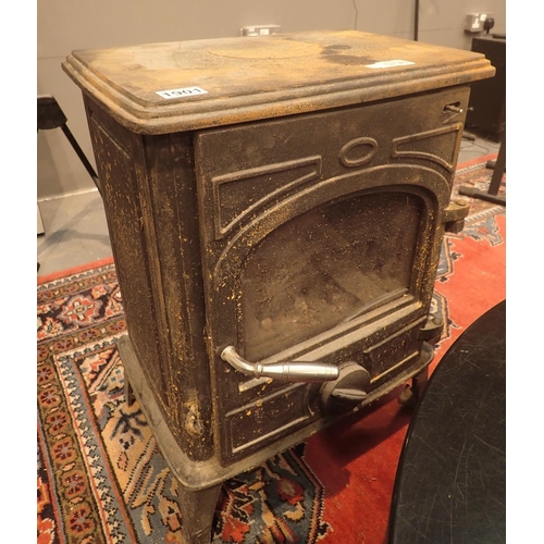 1901 - Heavy cast iron front opening wood burning stove, cracked glass