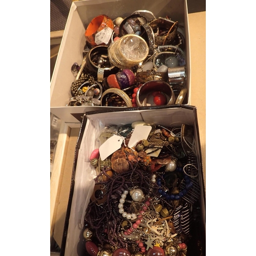 100 - Two boxes of unsorted jewellery