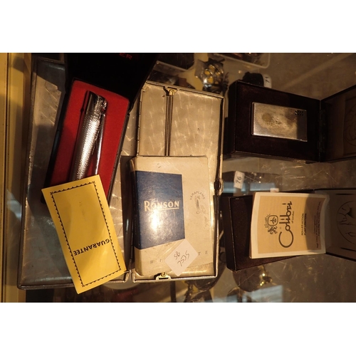 86 - Four mixed lighters, a pipe and a cigarette case