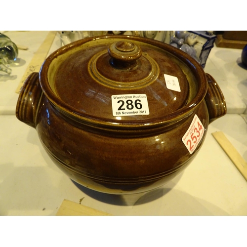 286 - Large lidded treacle glazed cooking pot