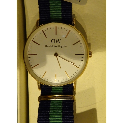 55 - New boxed Daniel Wellington wristwatch gold plated on a striped fabric strap