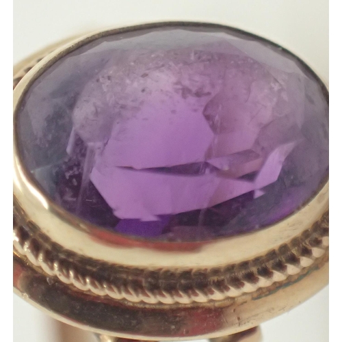 1031 - 9ct gold ring set with a large amethyst Size O