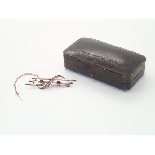 214 - A boxed Edwardian 9ct gold amethyst and seed pearl brooch, L: 52 mm, 2.6g
P&P group 1 (£16 for the f... 