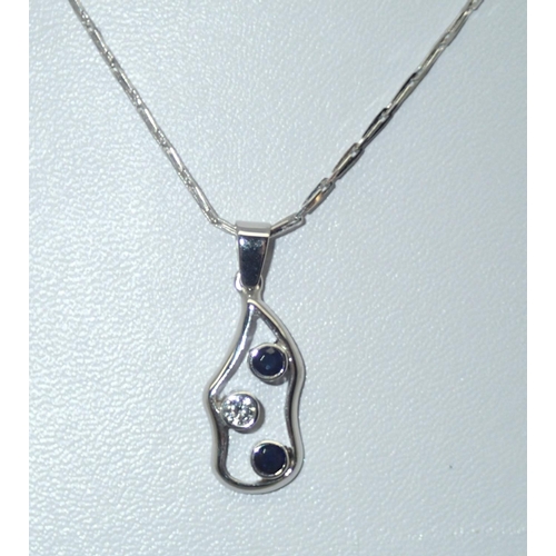 65 - A contemporary 18ct white gold sapphire and diamond pendant on an 18ct white gold chain, 4.9g
P&P gr... 