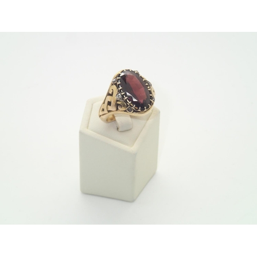 108 - Vintage heavy gauge yellow metal presumed 18ct gold gents ring set with a large oval garnet and six ... 