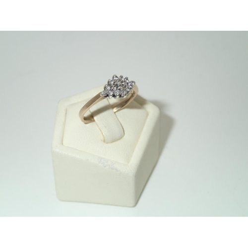 128 - Vintage 9ct gold diamond cluster ring, size J/K, 1.7g
P&P group 1 (£16 for the first item and £1.50 ... 