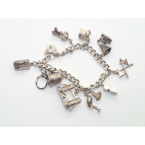 161 - Vintage silver charm bracelet with 10 charms, 52g
P&P group 1 (£16 for the first item and £1.50 for ... 