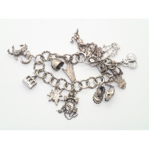 171 - Vintage silver charm bracelet with 14 charms and padlock clasp, 45g
P&P group 1 (£16 for the first i... 