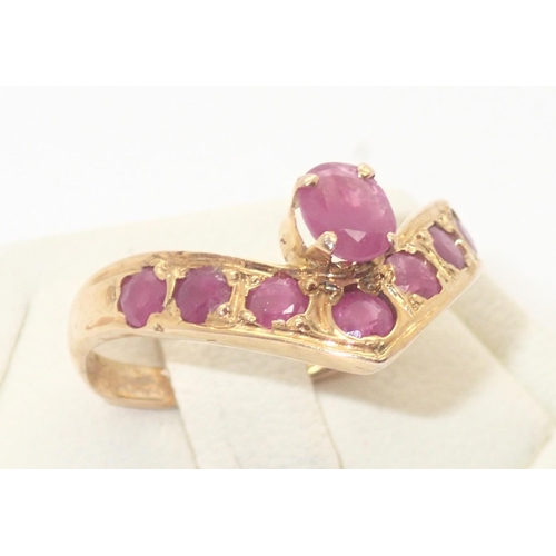 66 - 18ct gold eight stone wishbone ruby ring, size K, 2.1g
P&P group 1 (£16 for the first item and £1.50... 