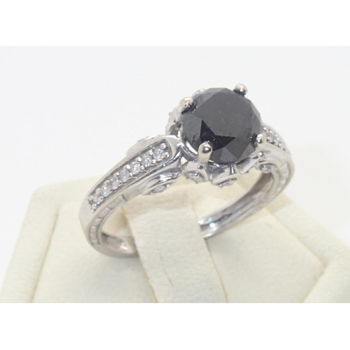 96 - 9ct white gold large black diamond solitaire ring with diamond set shoulders, size K, 2.7g diamond t... 