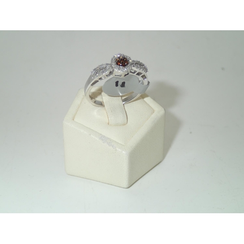 182A - Ladies silver, white and brandy coloured diamond ring 
Size Q 2.6g
P&P group 1 (£16 for the first it... 