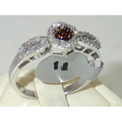 182A - Ladies silver, white and brandy coloured diamond ring 
Size Q 2.6g
P&P group 1 (£16 for the first it... 