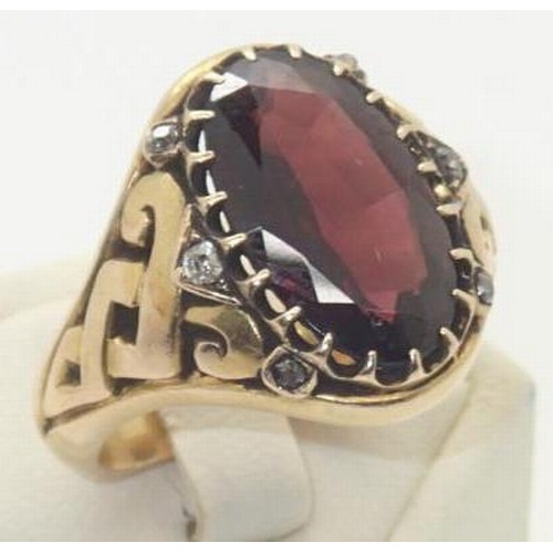 108 - Vintage heavy gauge yellow metal presumed 18ct gold gents ring set with a large oval garnet and six ... 
