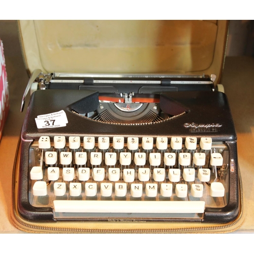 37 - Olympia portable cased typewriter. P&P Group 2 (£18+VAT for the first lot and £2+VAT for subsequent ... 