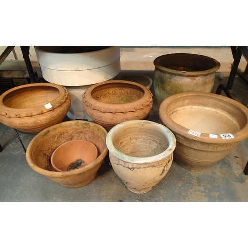 525 - Seven earthenware garden pots, two matching with stands, two large white pots and other examples. Th... 