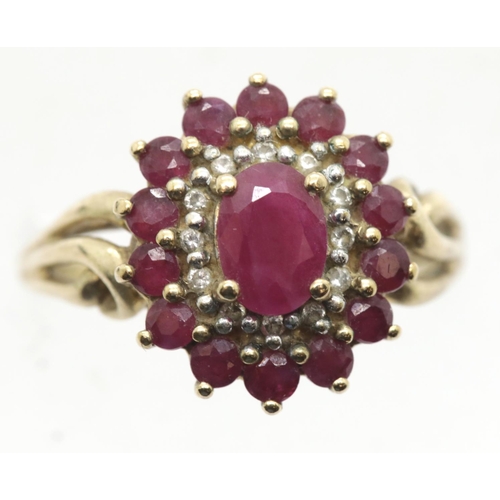 1030 - 9ct gold, ruby and diamond cluster ring size R/S, 3.9g. P&P Group 1 (£14+VAT for the first lot and £... 