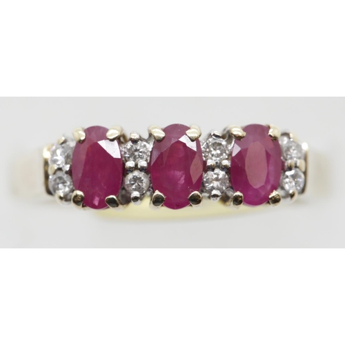 1047 - 70s style three stone ruby and diamond fancy ring, size O, 3.0g. P&P Group 1 (£14+VAT for the first ... 