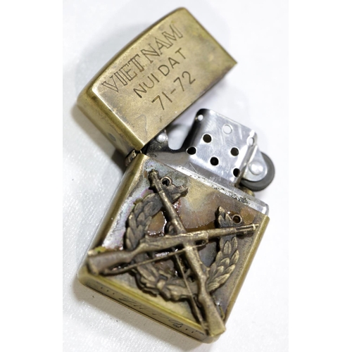 1585 - Zippo brass lighter inscribed Vietnam Nui Dat and dated 71-72, with applied part cap-badge, having f... 