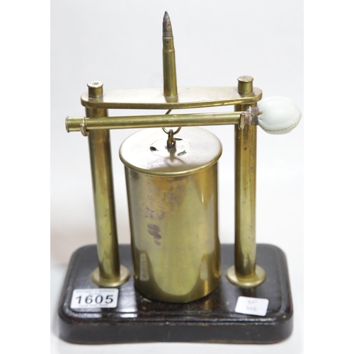 1605 - WWI style trench art dinner gong with clapper, raised on a rectangular plinth, H: 27 cm. P&P Group 2... 