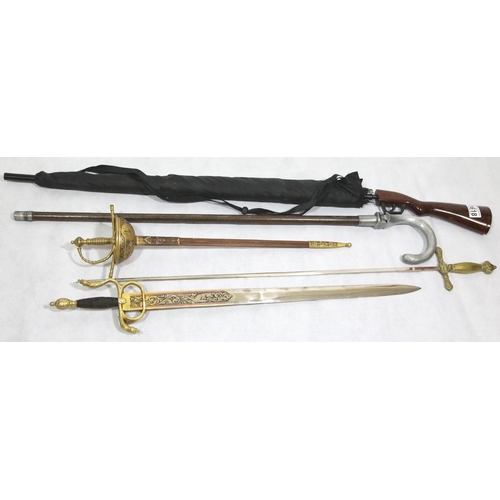 1618 - Collection of modern display swords, a shooting stick and a rifle-form umbrella. P&P Group 3 (£25+VA... 